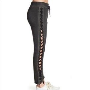 Pam and Gela laced up charcoal sweat pants.